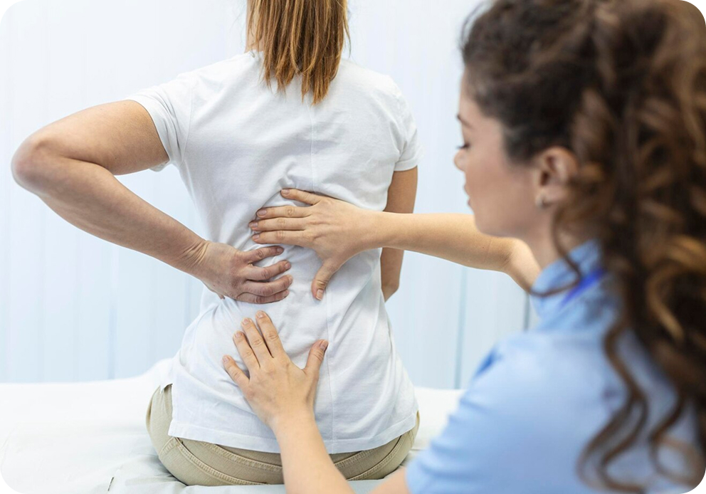 Doctor showing spine model to a patient